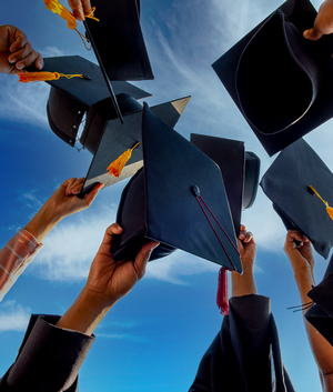 the graphic depicts a group of graduates lifting birets up